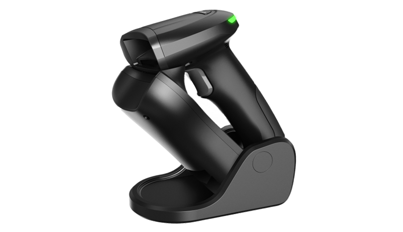 Handheld scanner barcód on a table.